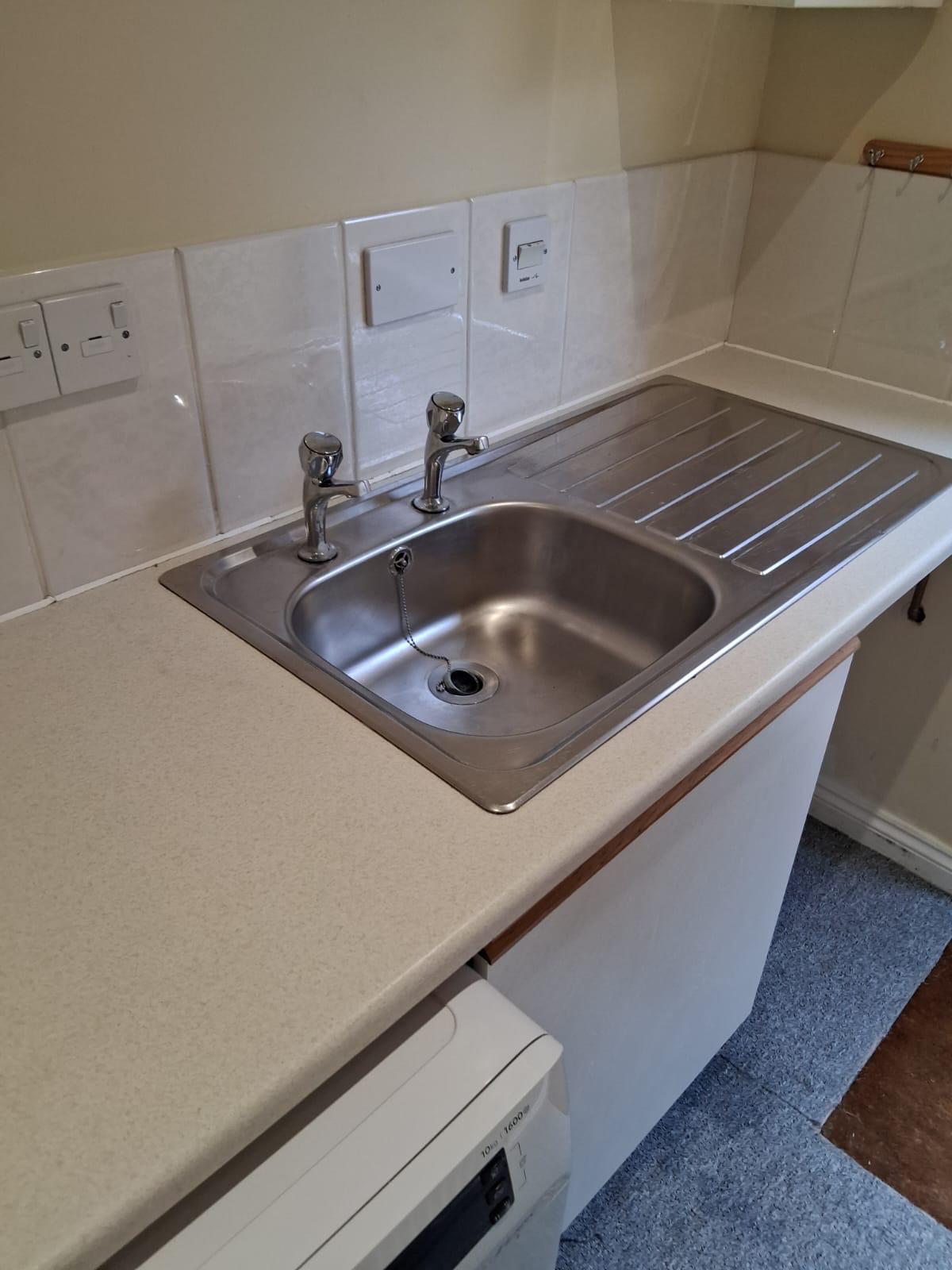 Standard cleaning - kitchen worktop and sink cleaned